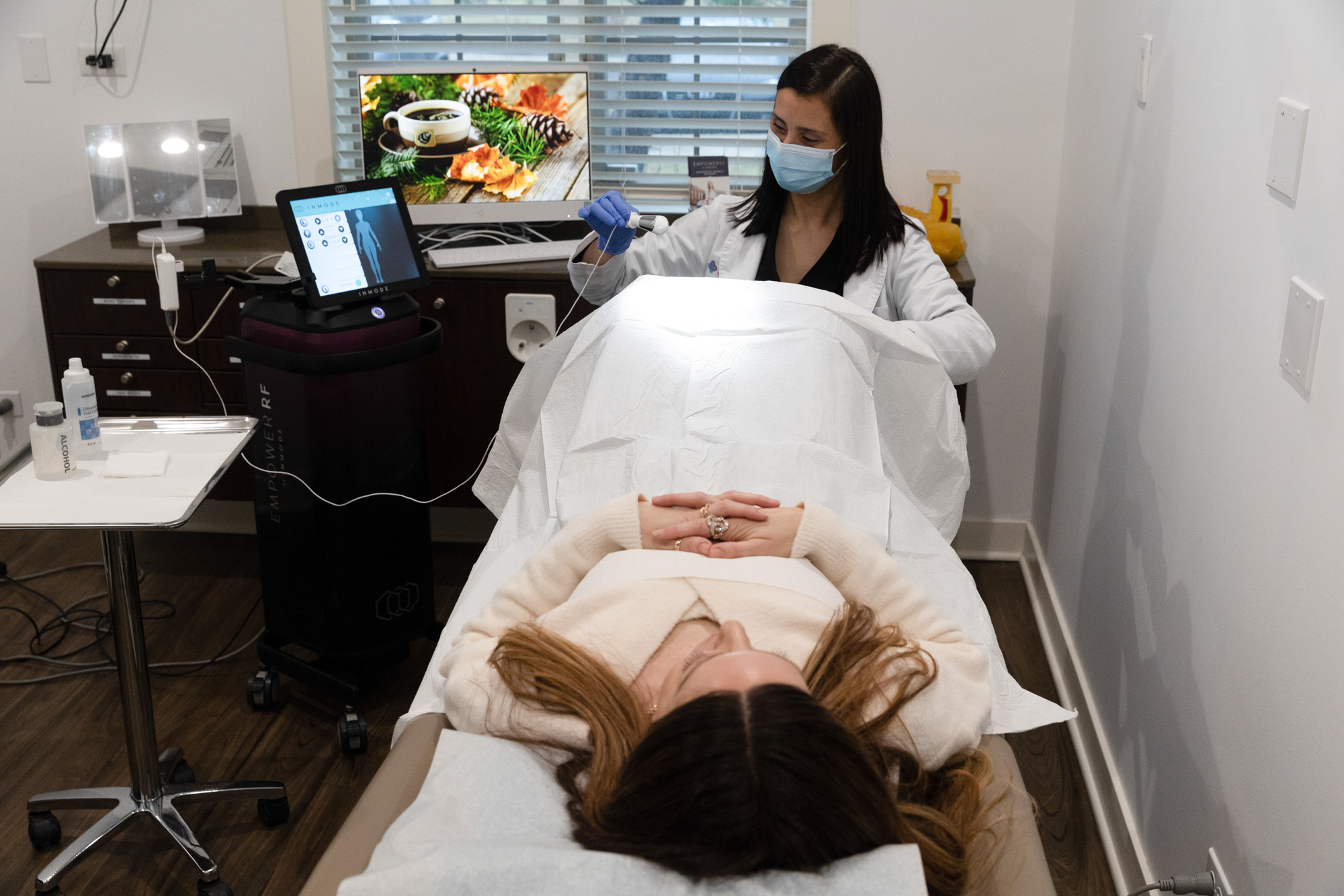 A Heal n Cure practitioner prepares the VTone device for a patient's urinary incontinence treatment near Northbrook.